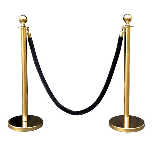 Two brass stanchions with a black velvet rope