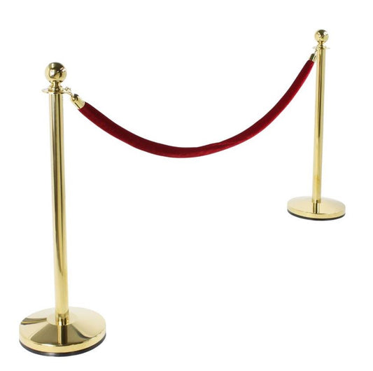 Brass stanchion set for rent with burgundy red velvet rope