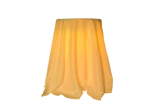 Highboy pub table with draped cloth and amber lighting. Table is for rent in Long Island New York